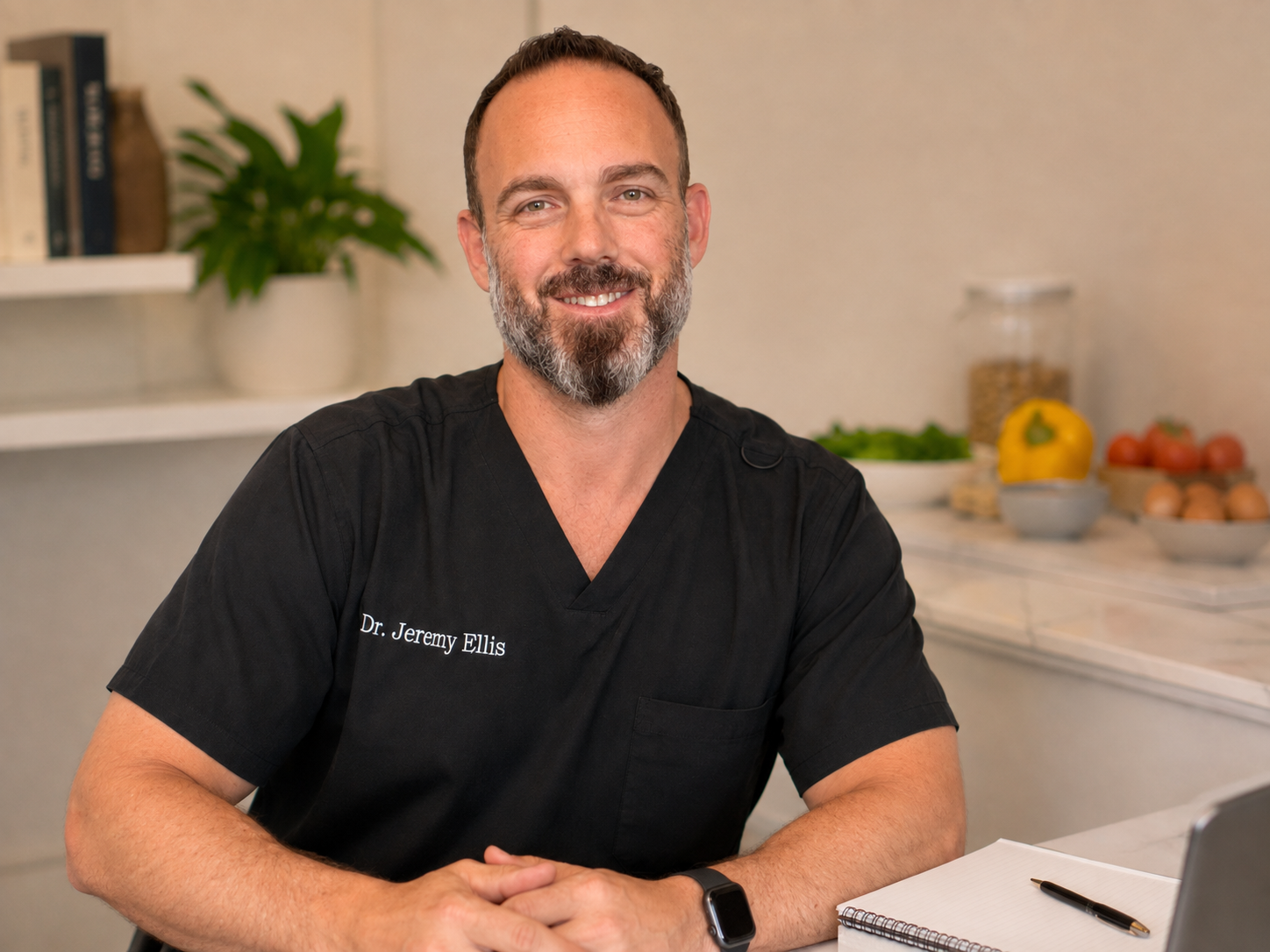 Dr. Jeremy Ellis in a consultation setting discussing food sensitivities and digestive symptoms